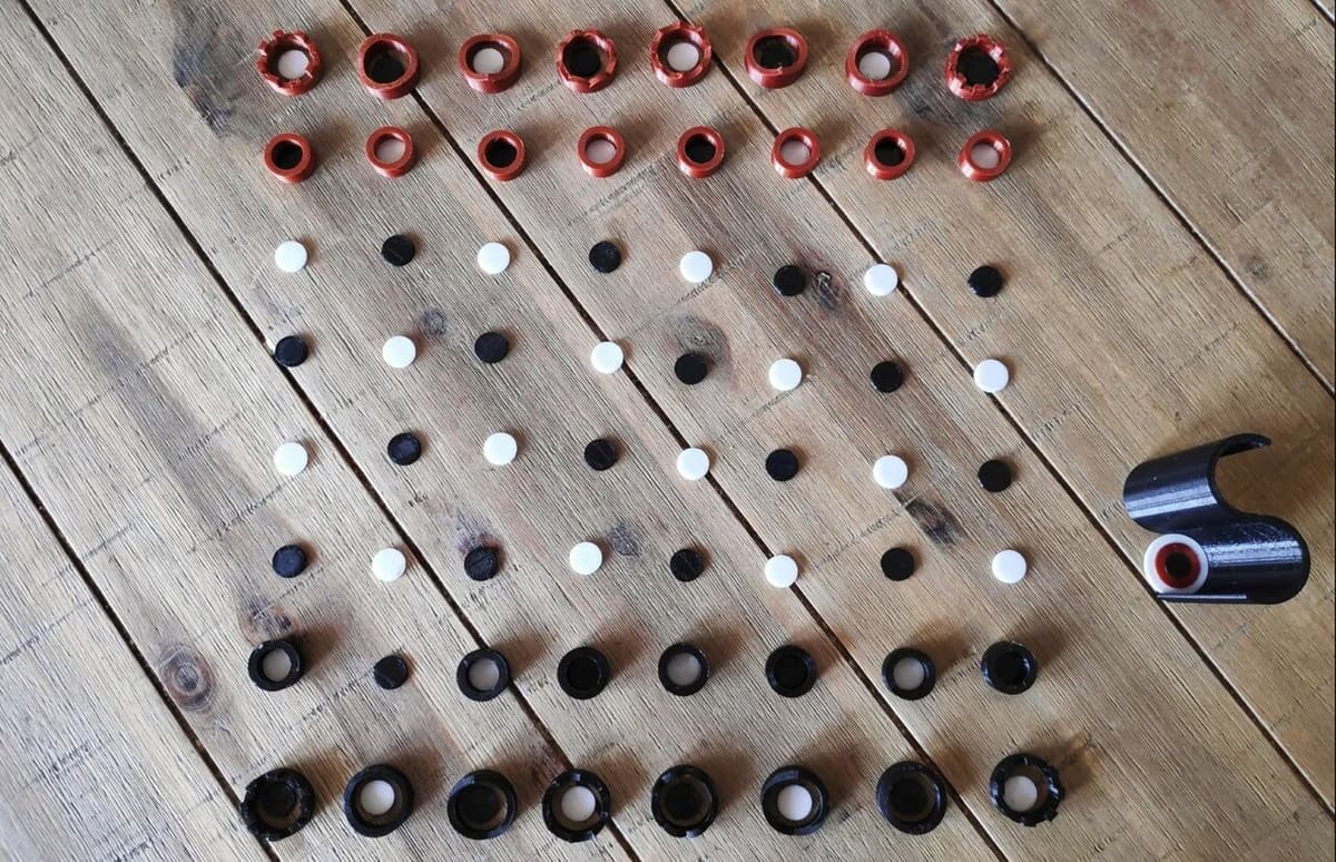 A stackable chess set made of rings and dots