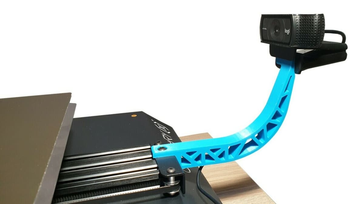 OctoPrint allows you to monitor your prints with a USB camera for safe remote printing