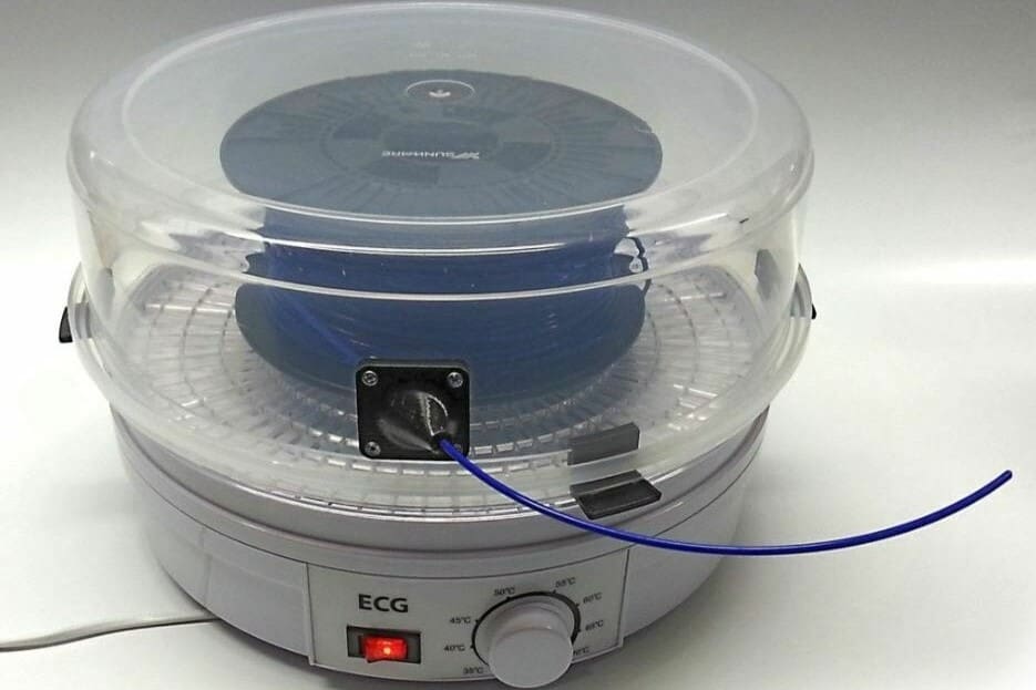 Food dehydrators can usually hold at least one spool of filament