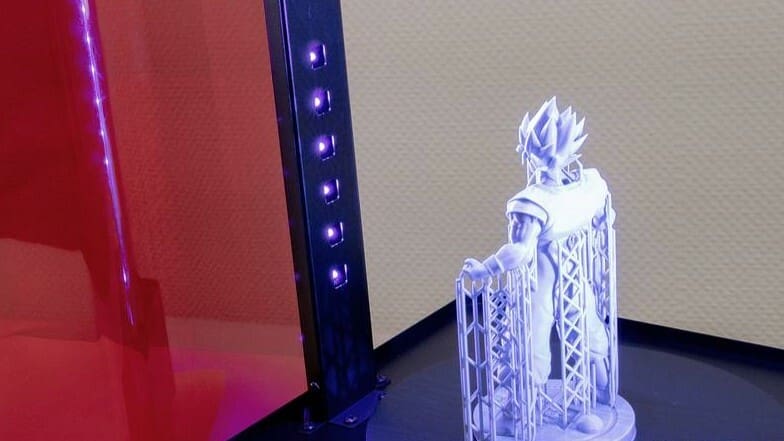 Resin prints being cured with UV light