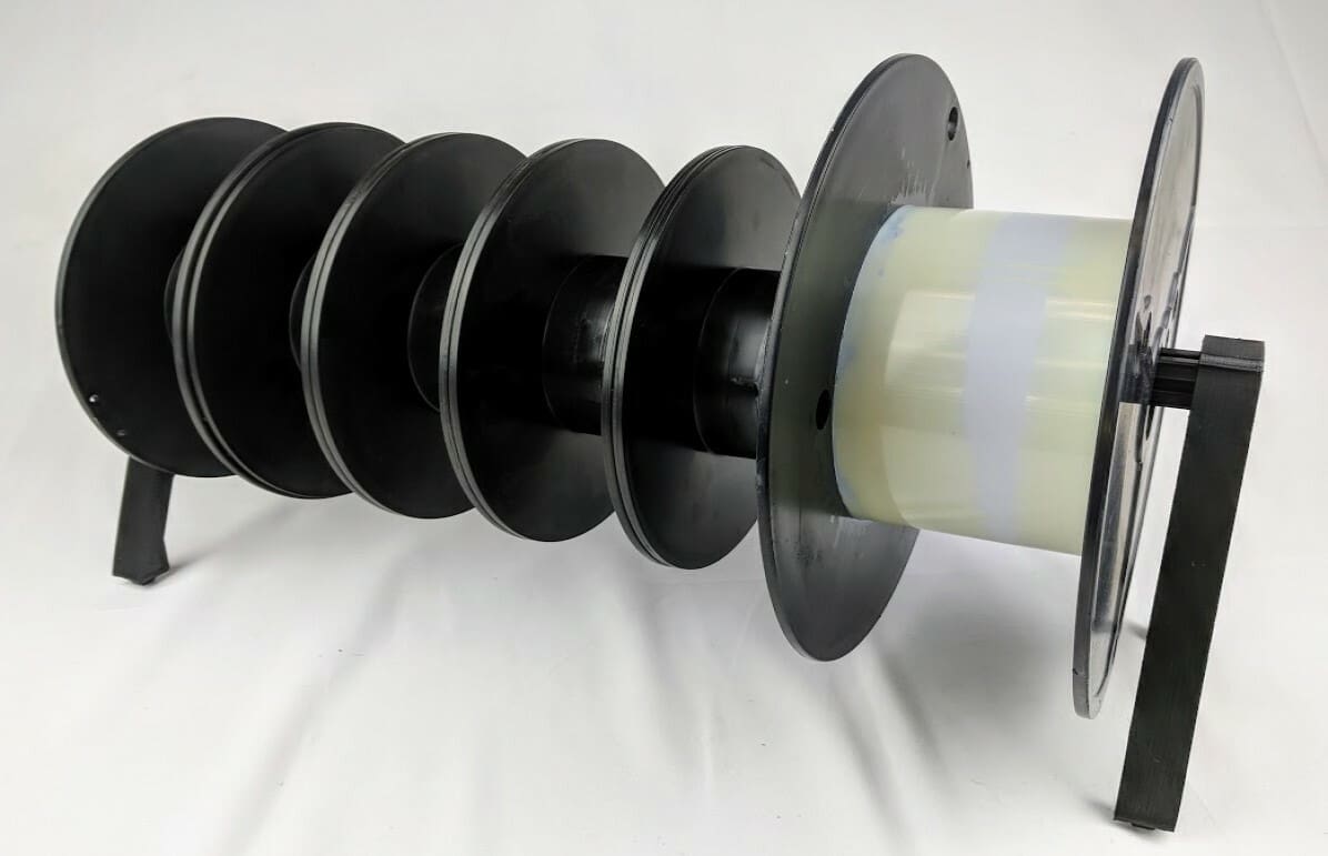 A stand capable of supporting filaments that weigh up to a total of 61 kg