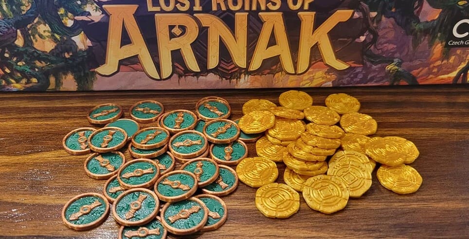 Lost Ruins of Arnak coins and compasses