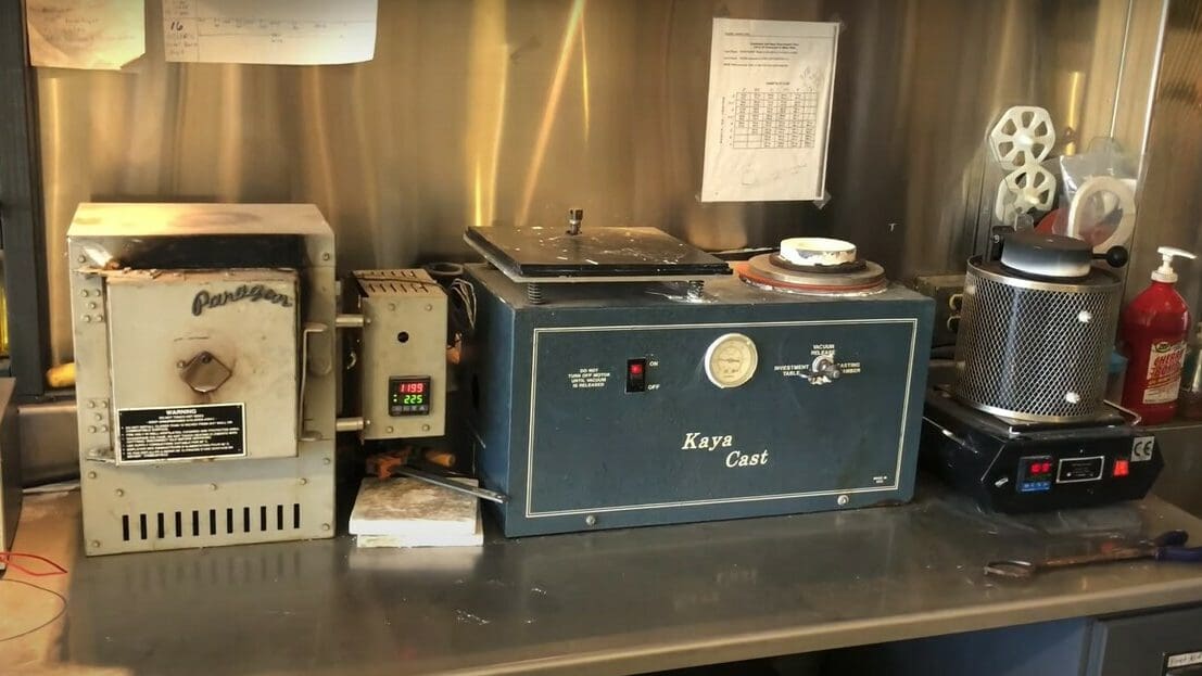 The full casting setup: A kiln, vacuum chamber, and a electric furnace