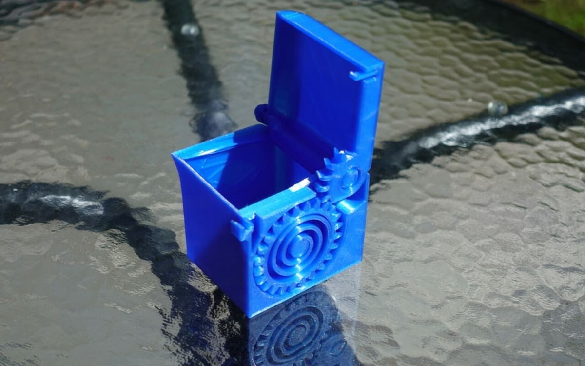 This print-in-place box uses both gears and springs
