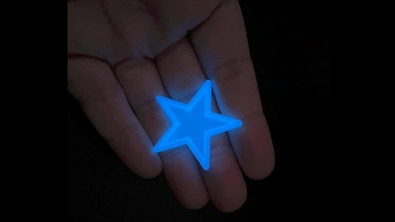 A brilliant blue glow-in-the-dark star