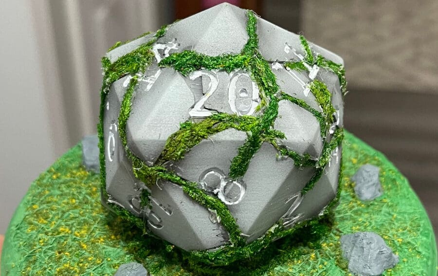 These cracked dice are a good match with the D&D theme