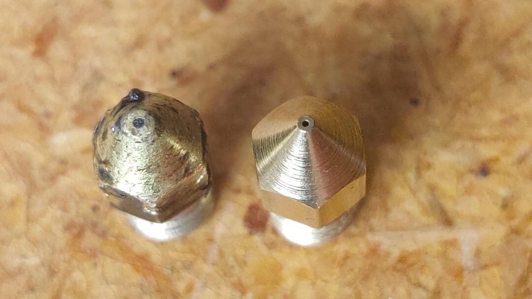 The wear on a brass nozzle after printing with carbon fiber filament for 15 hours