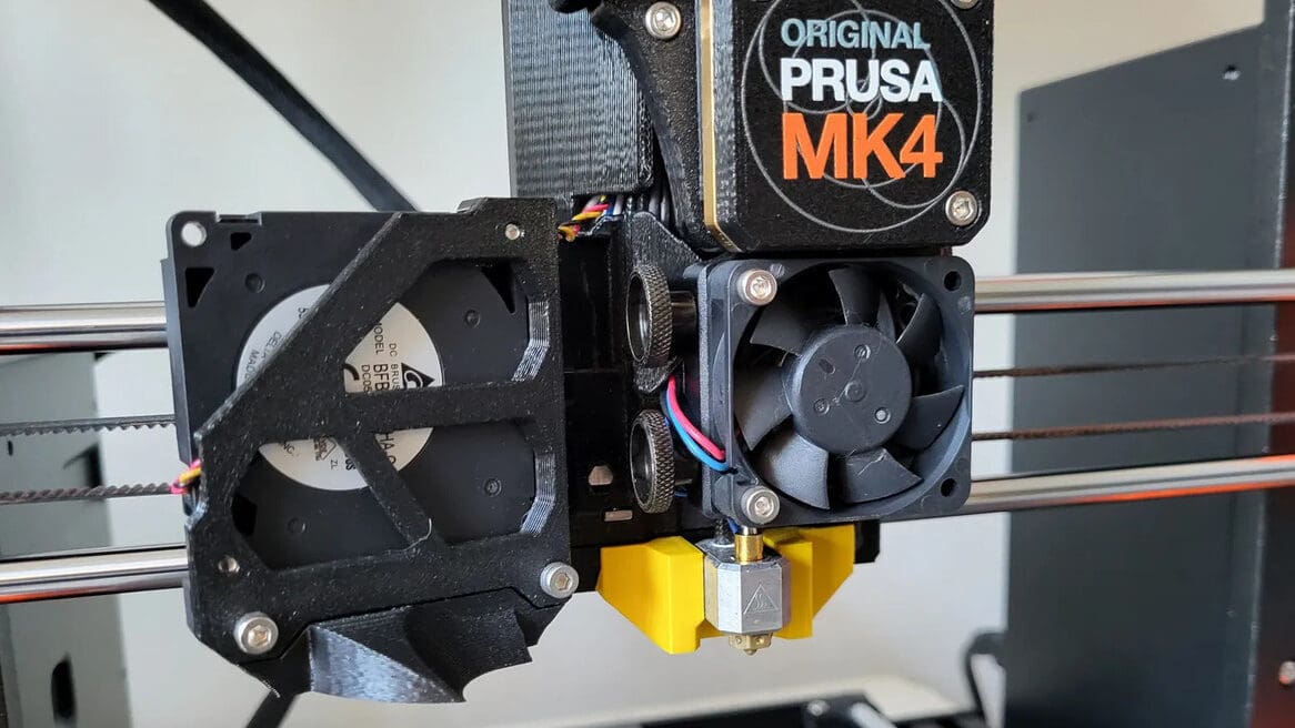 The Nextruder heater block clamp printed in yellow