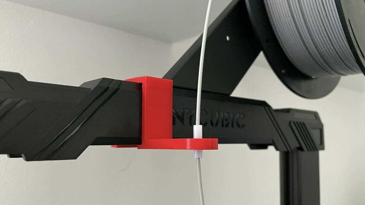 This filament guide is push to fit and works on the original Kobra