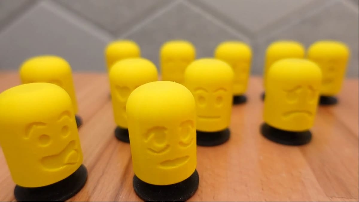 These mini bobbleheads can sit on top of your printer’s head