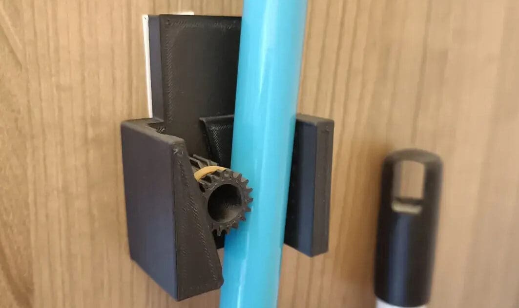 Mount your brooms on the wall with this two piece holder