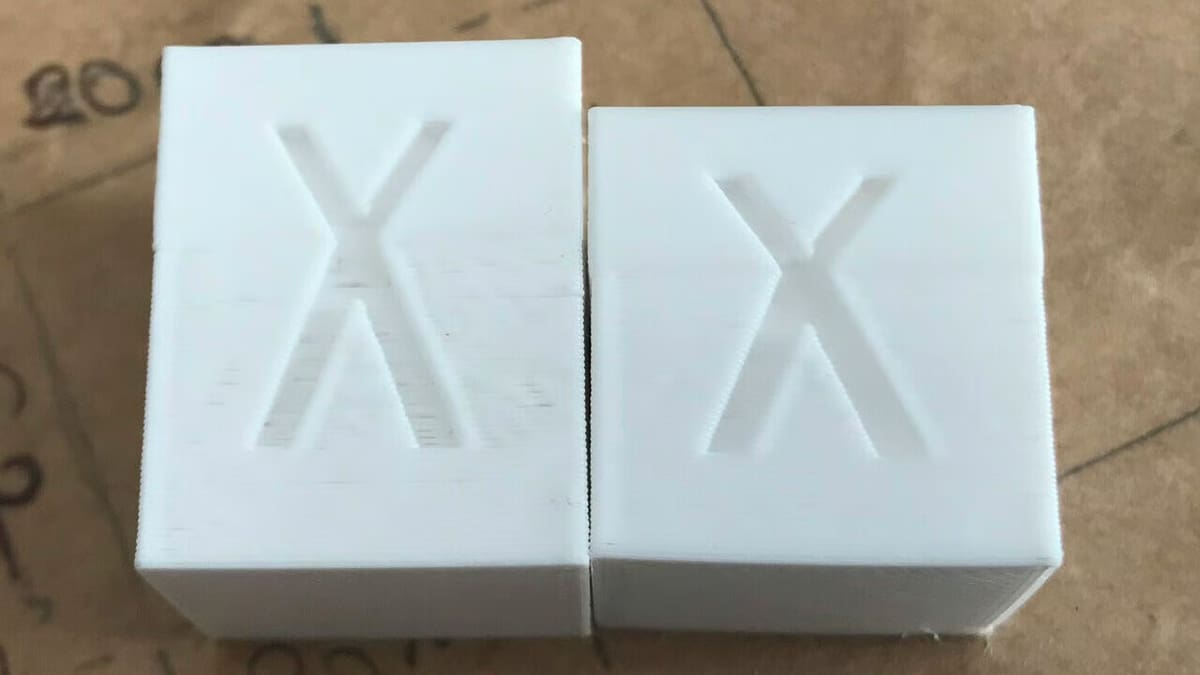 The stretched calibration cube (left) was printed by an uncalibrated 3D printer